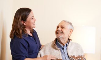 nurse-with-resident-in-wheelchair_700x650
