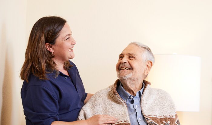 nurse-with-resident-in-wheelchair_700x650