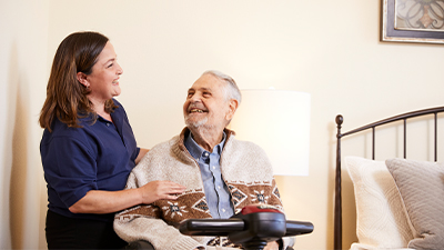 man-in-wheelchair-smiling-at-nurse