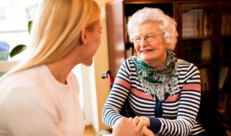 Caregiving: A grandma and granddaughter hold hands