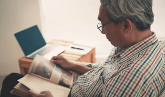 a man reads a magazine, senior living