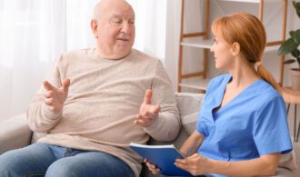 A senior patient talks with a provider, Memory Care in Montrose Colorado