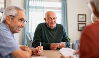 3 elderly men enjoy each others company independent living