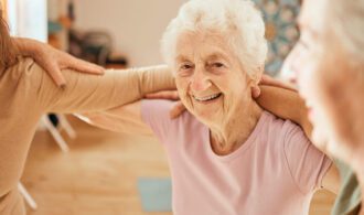 A old woman smiles in memory care