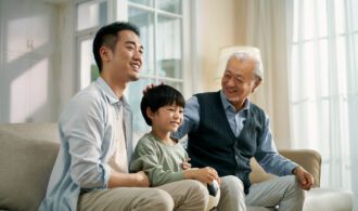 generations sit on the couch together