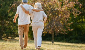 A couple walk arm in arm at Montage Creek