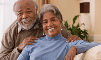 A senior couple embraces at Carmel Village Assisted Living