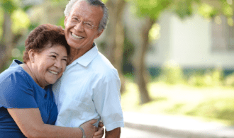 A couple embraces at Carmel Village
