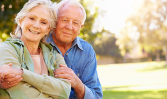 A senior couple embraces at Fairfield Village